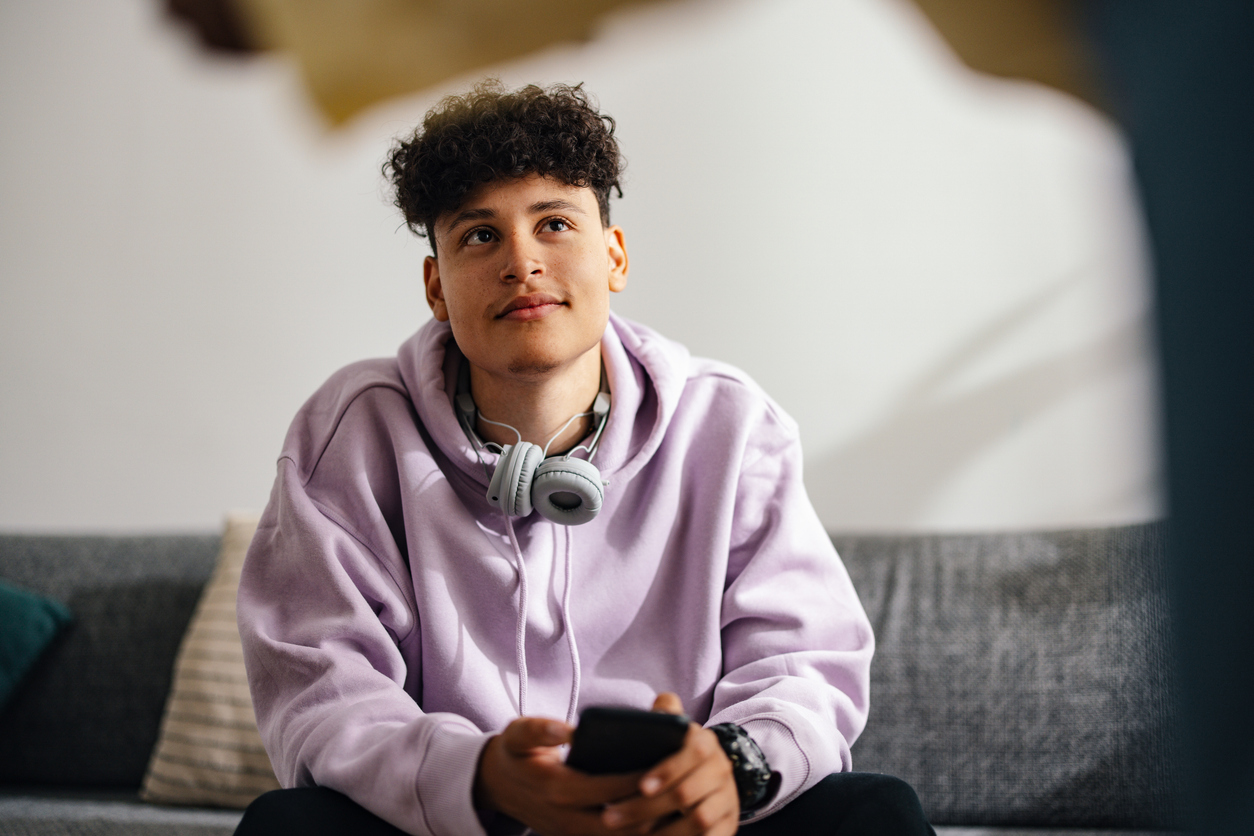 Young Boy with Headphones Relaxing at Home